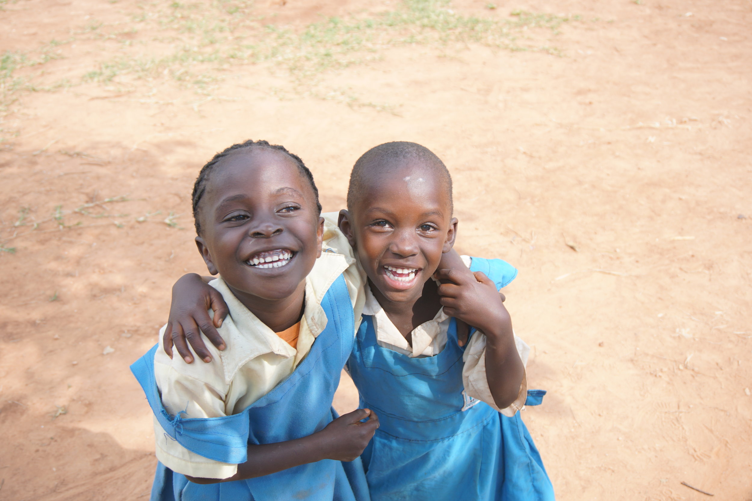 While the boys were generally the first ones to pose with their friends for the camera, some of HIP's girls started getting less camera shy as they grew more used to the OWC team.