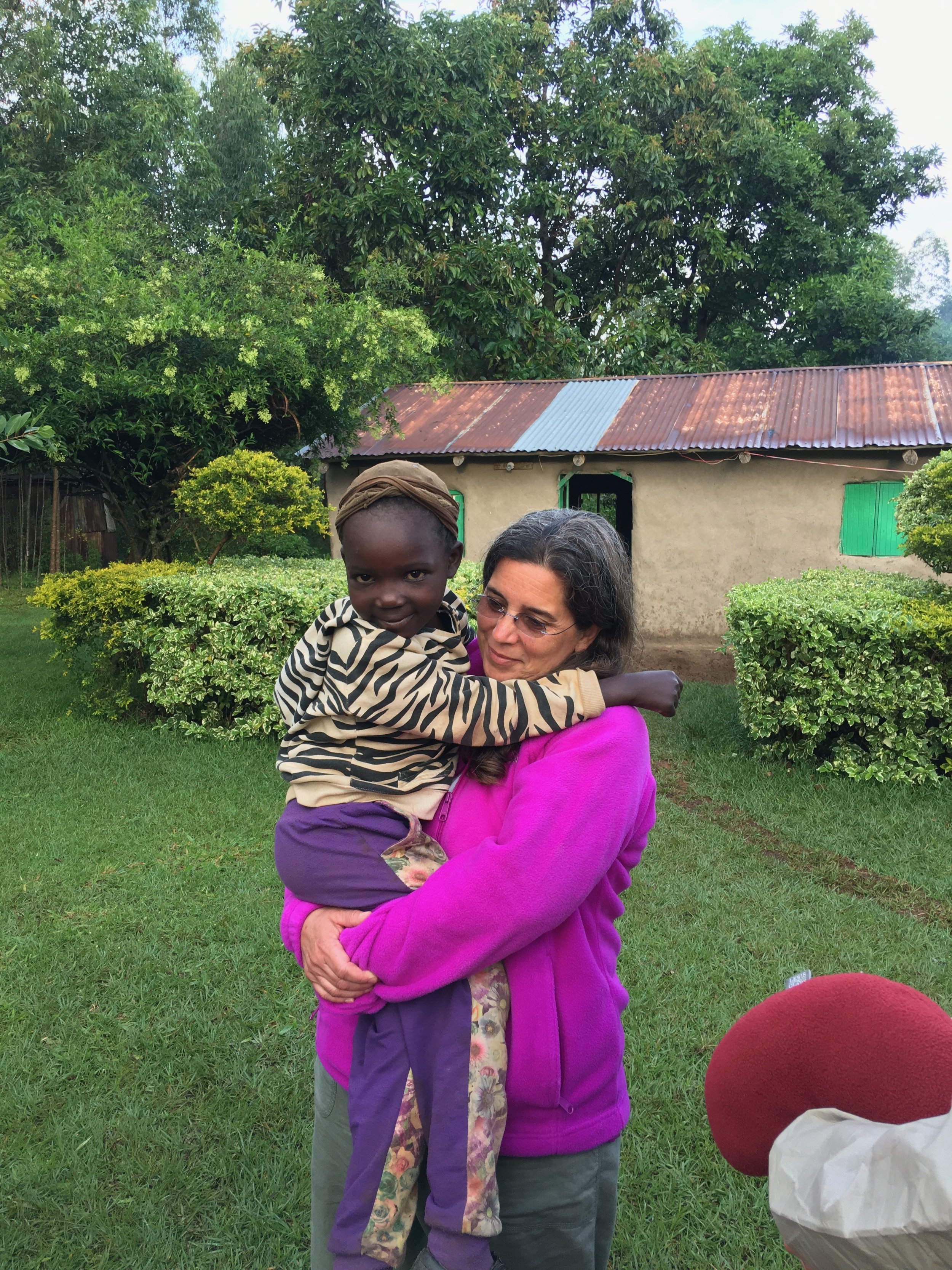  Melissa getting some last minute hugs from Livingstone's niece before we head to Mt. Elgon. 