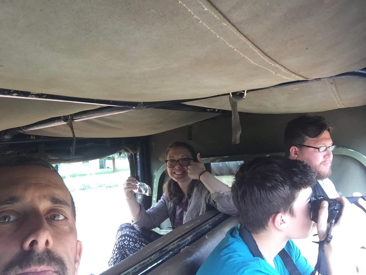  Natalie giving John the thumbs up as she snacks on food we had gotten in Kitale before arriving at Mt. Elgon. 