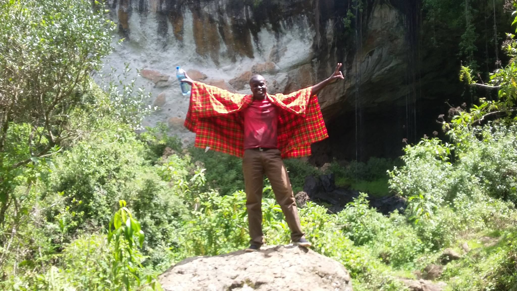 Livingstone found a boulder in front of Mackingeny Cave. He was the first to climb up to get a picture.