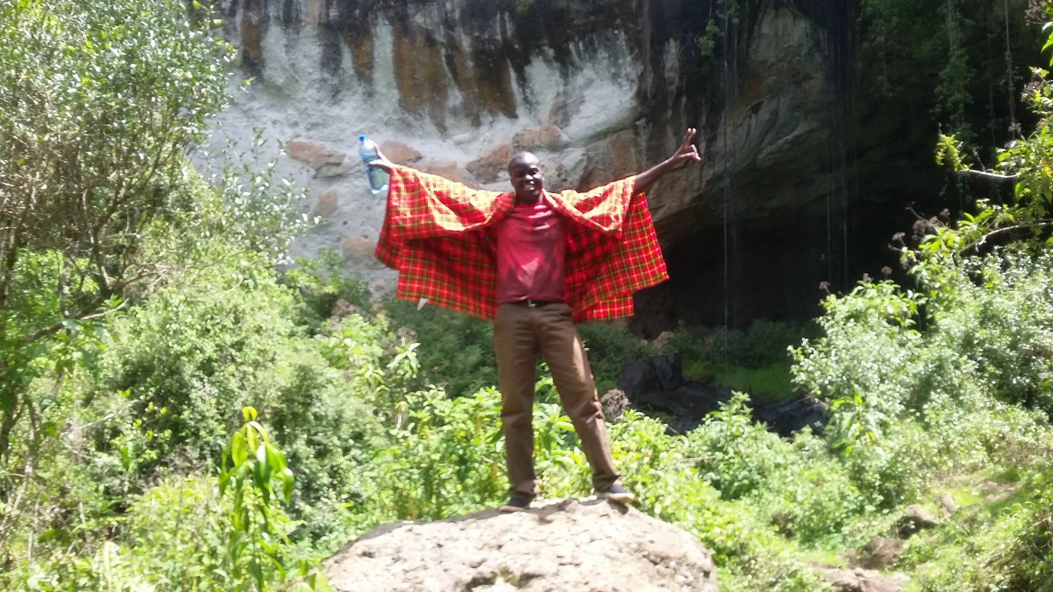 Livingstone found a boulder in front of Mackingeny Cave. He was the first to climb up to get a picture.
