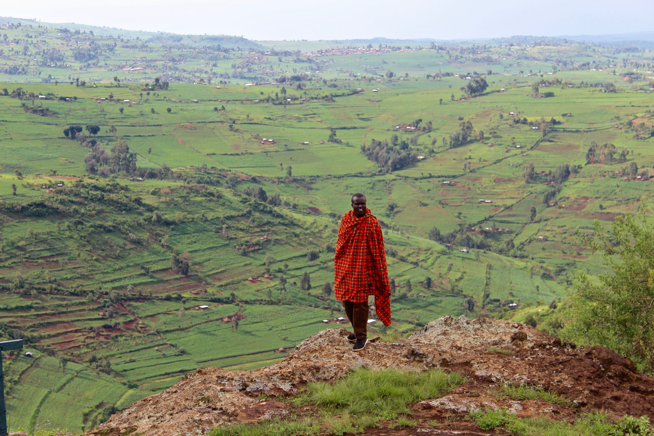  This was our favorite overlook at Mt. Elgon. Livingstone is posed with the Kenyan countryside in the background. If you look closely, you can see fields and houses. 
