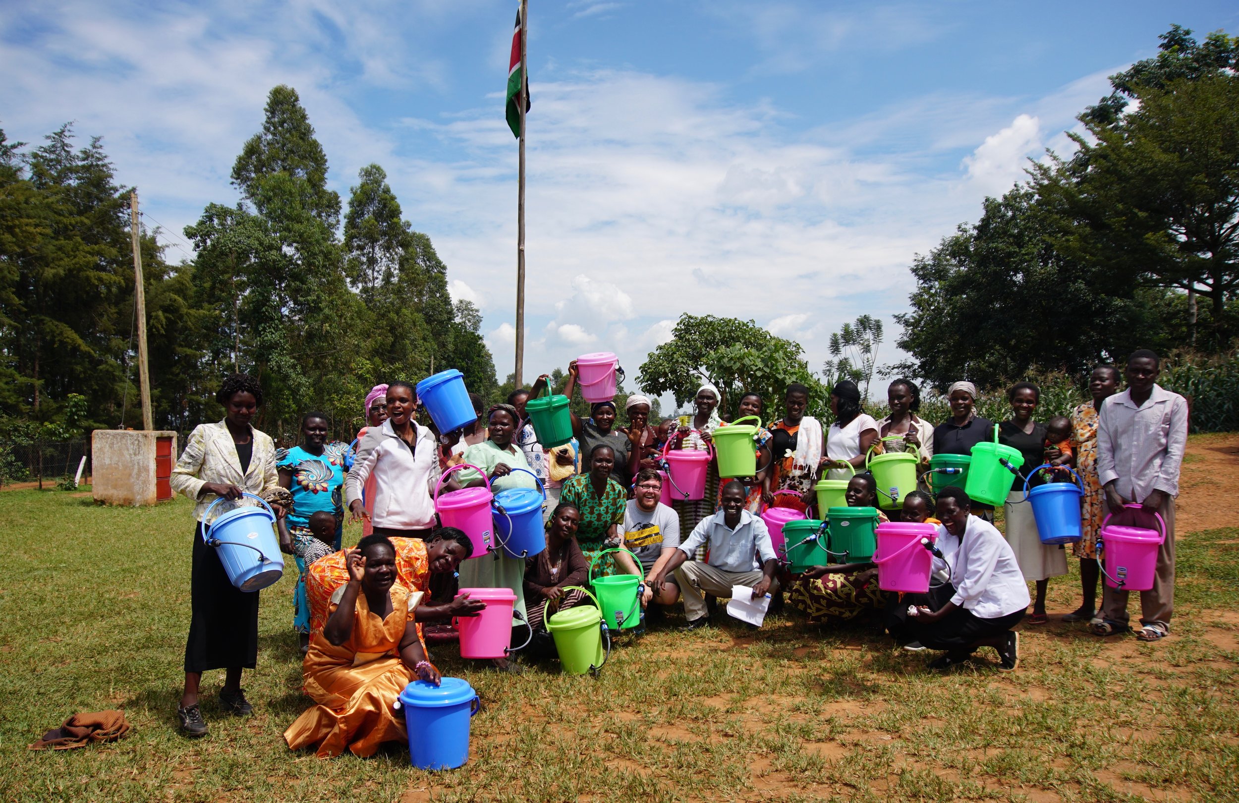 After the water demonstration, members of the community posed for a picture with Connor.