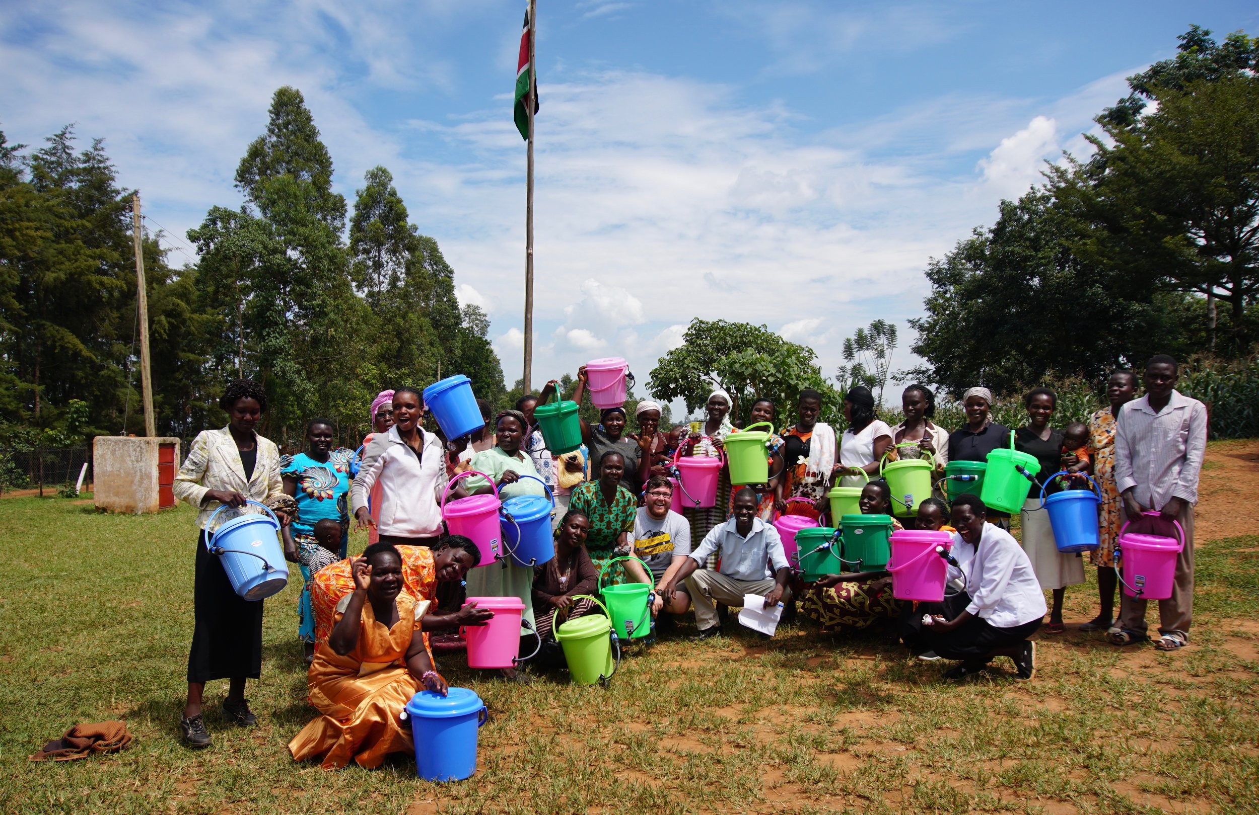  After the water demonstration, members of the community posed for a picture with Connor. 