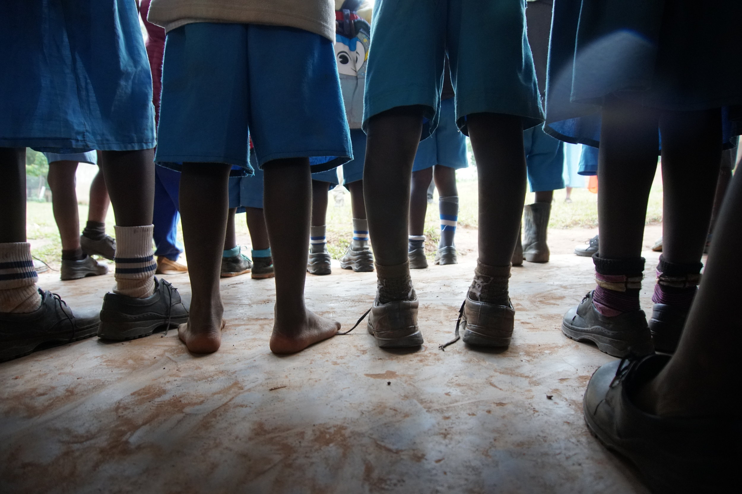  This picture says so many words. Each pair of shoes (or lack thereof) tells a story--where the students have been and where they have yet to go. 