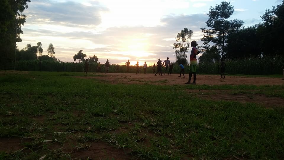  Members of the community gathered on the schools soccer pitch to play a game at sunset. 