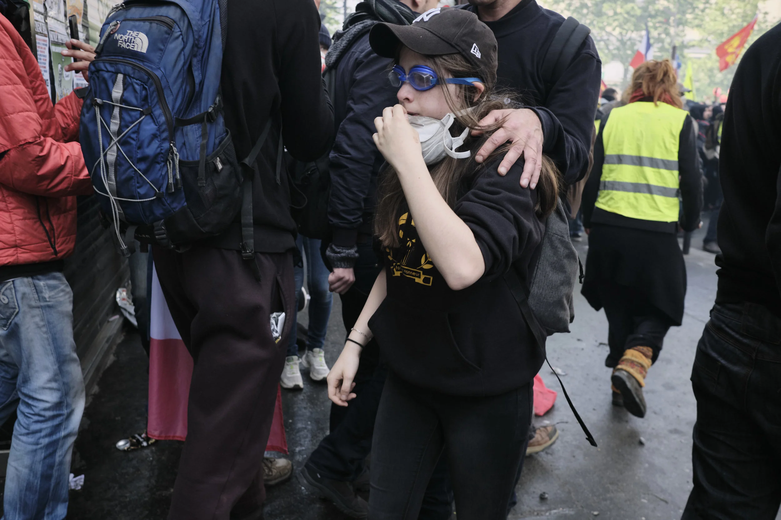 Protest participants trying to get away from the tear gas fired by the police in attempt to control the crowds at Boulevard du Montparnasse.