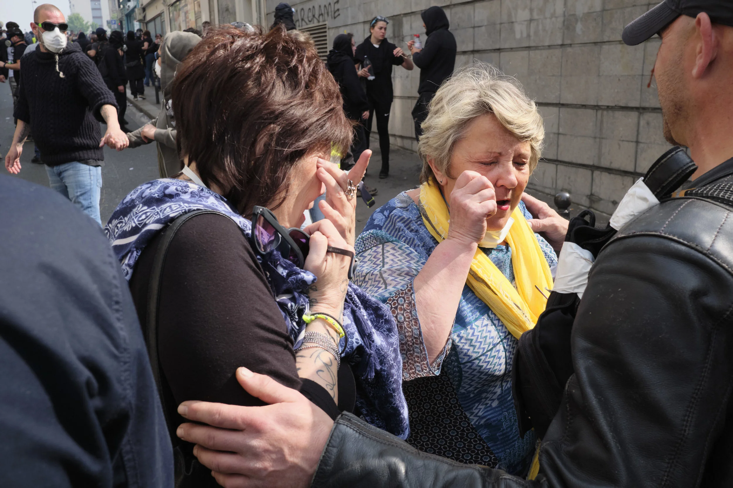 Peaceful participants have their eye’s washed from tear gas by other participants of the protests after a police attempt to control the crowds with tear gas.