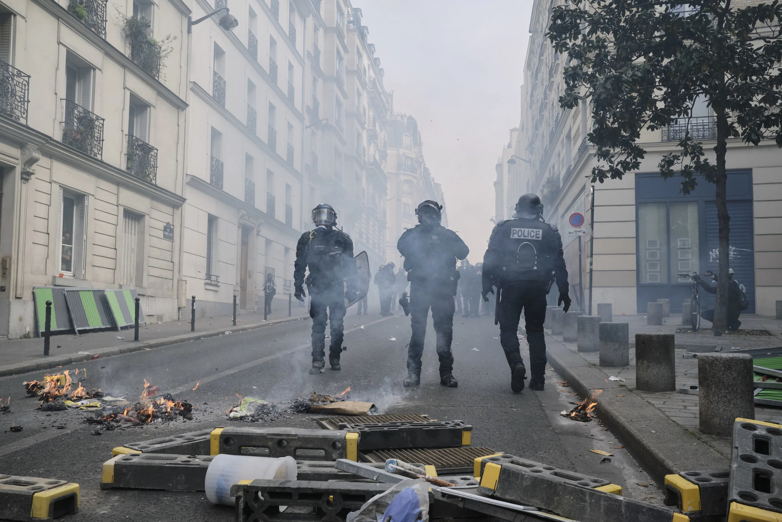 Riot police officers after a successful attempt to control the crowds.