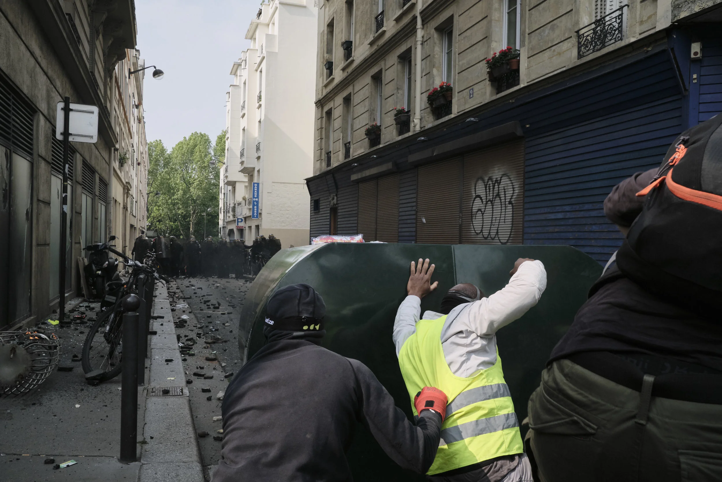 Protesters pushing the police away with their mobile blockade during a violent confrontation at The Boulevard Arago. 