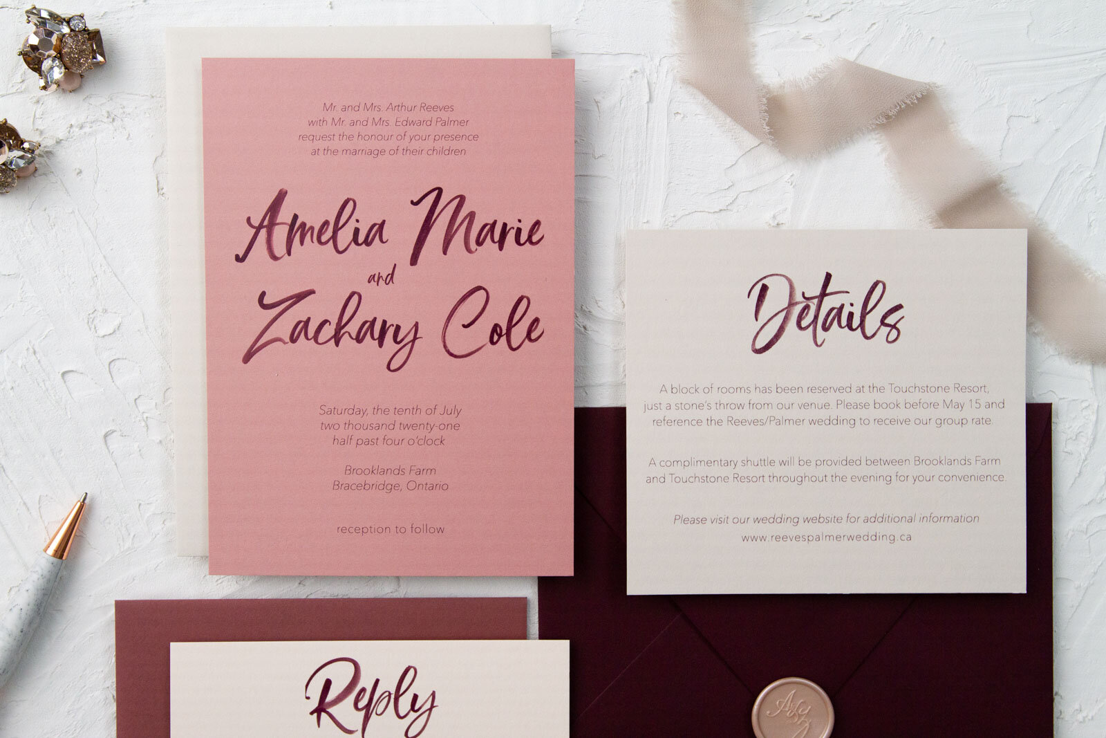 Our matching wedding invitation and details card with burgundy watercolour script on dusty rose and pale oatmeal card stocks.