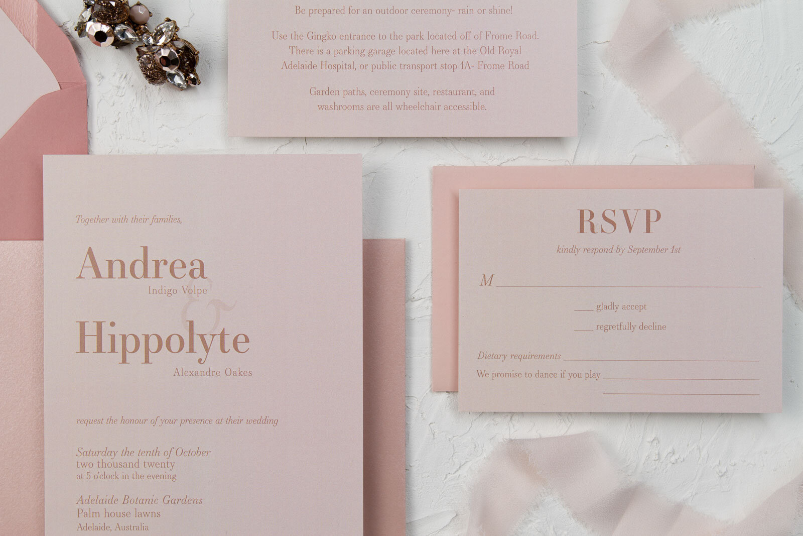  Semi-custom wedding invitation and matching rsvp card made on dusty rose paper with terracotta coloured text. 