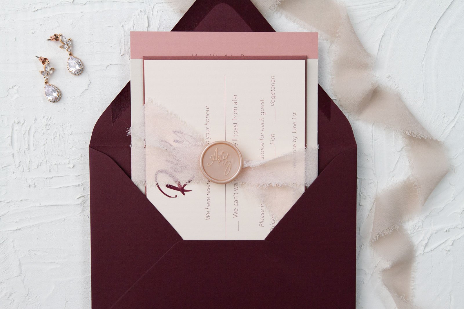 blush-and-burgundy-assembled-wedding-invitation-with-ribbon-and-wax-seal-2.jpg
