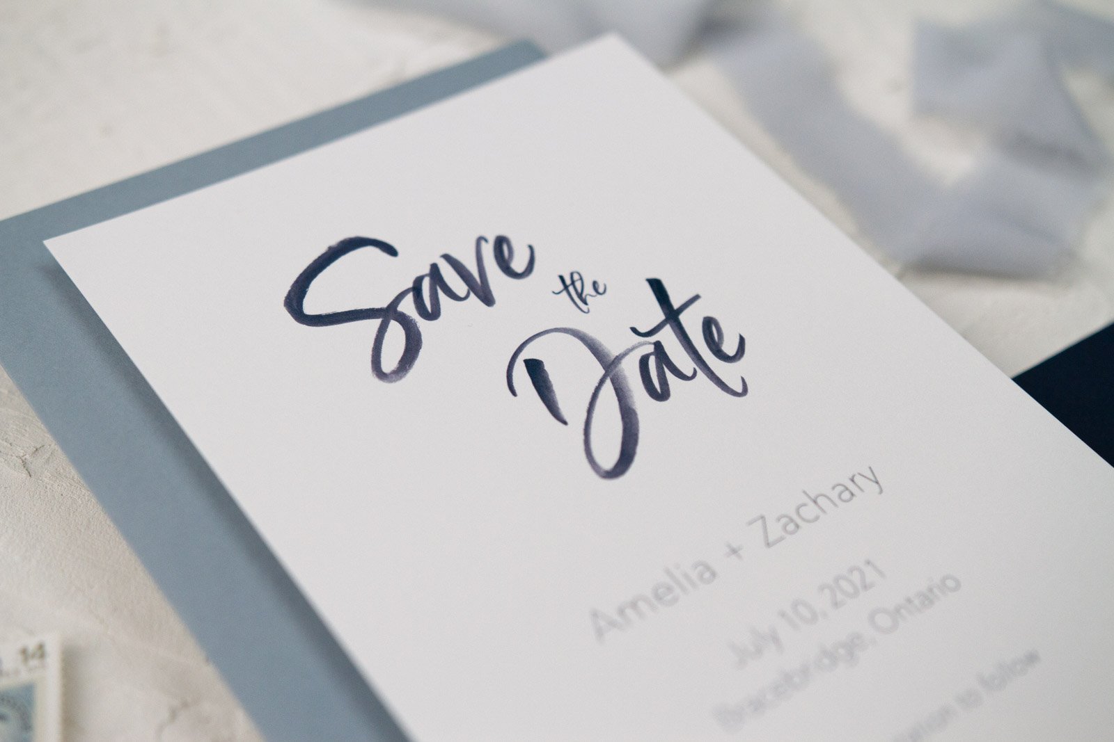 dusty-blue-and-navy-modern-watercolour-brush-script-wedding-save-the-date-4.jpg