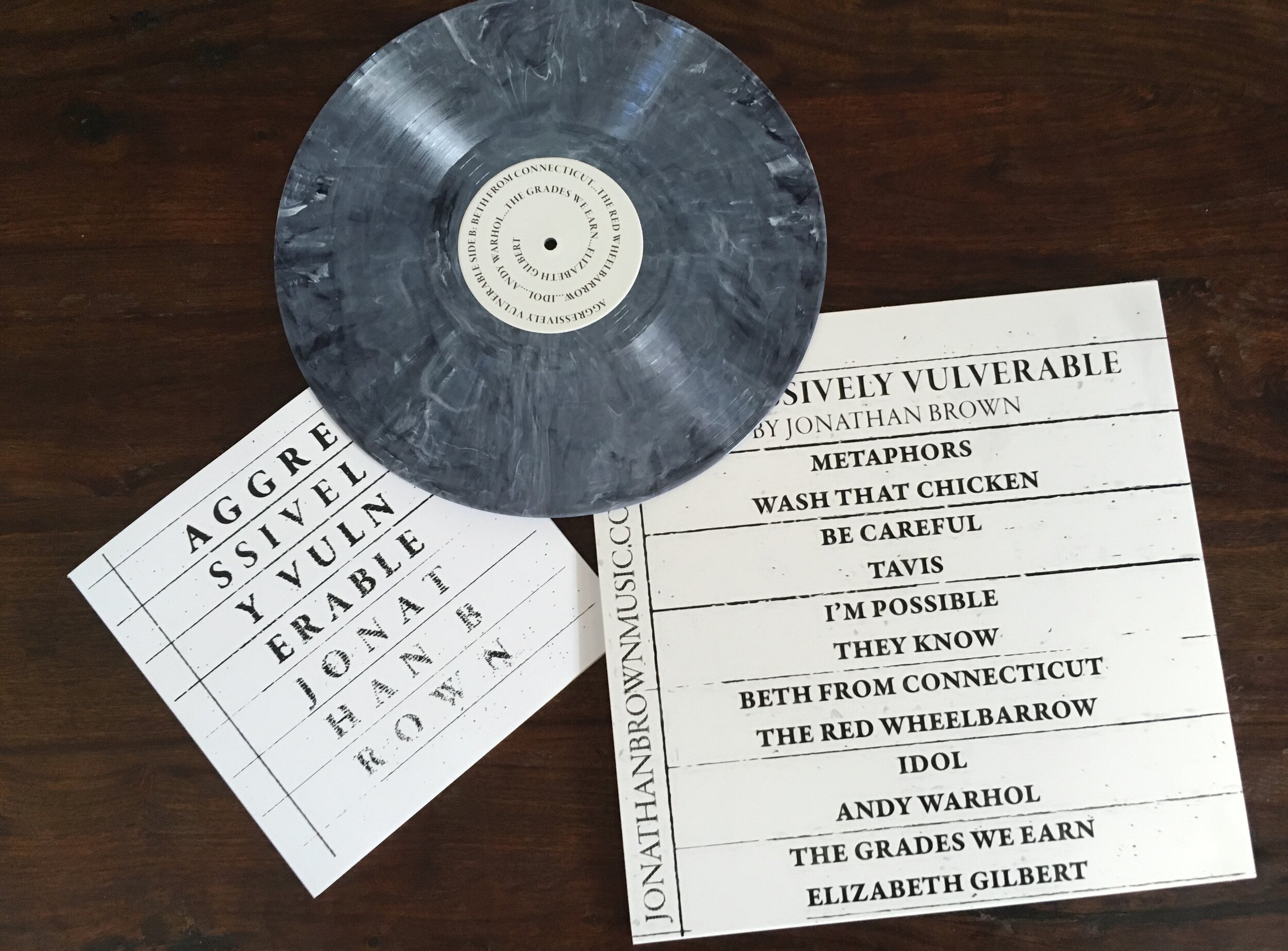 Aggressively Vulnerable vinyl record with book