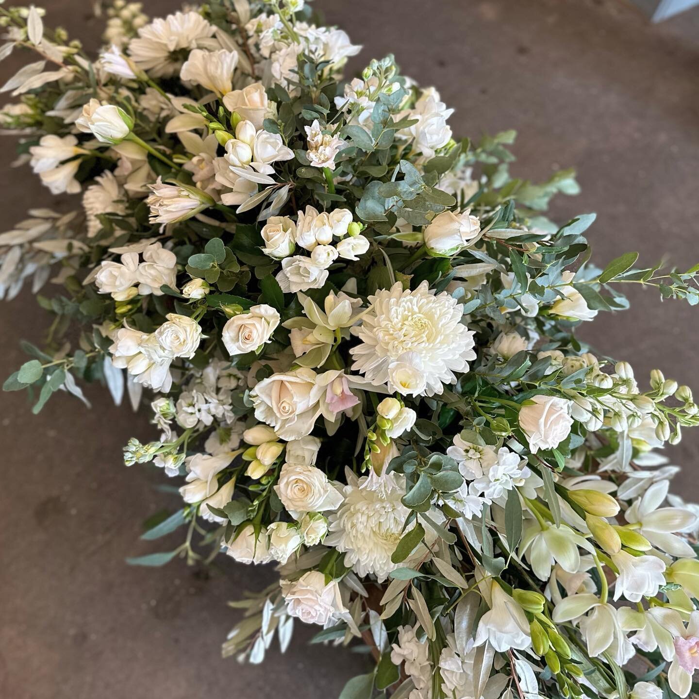 Farewell blooms for a clients special love. You can&rsquo;t really beat the classic elegance of a white traditional spray and you know we weirdos love making memorial flowers 👌