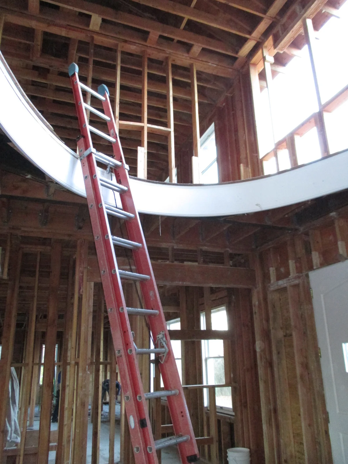 Look up: This foyer's oval balcony, pre-staircase installation.