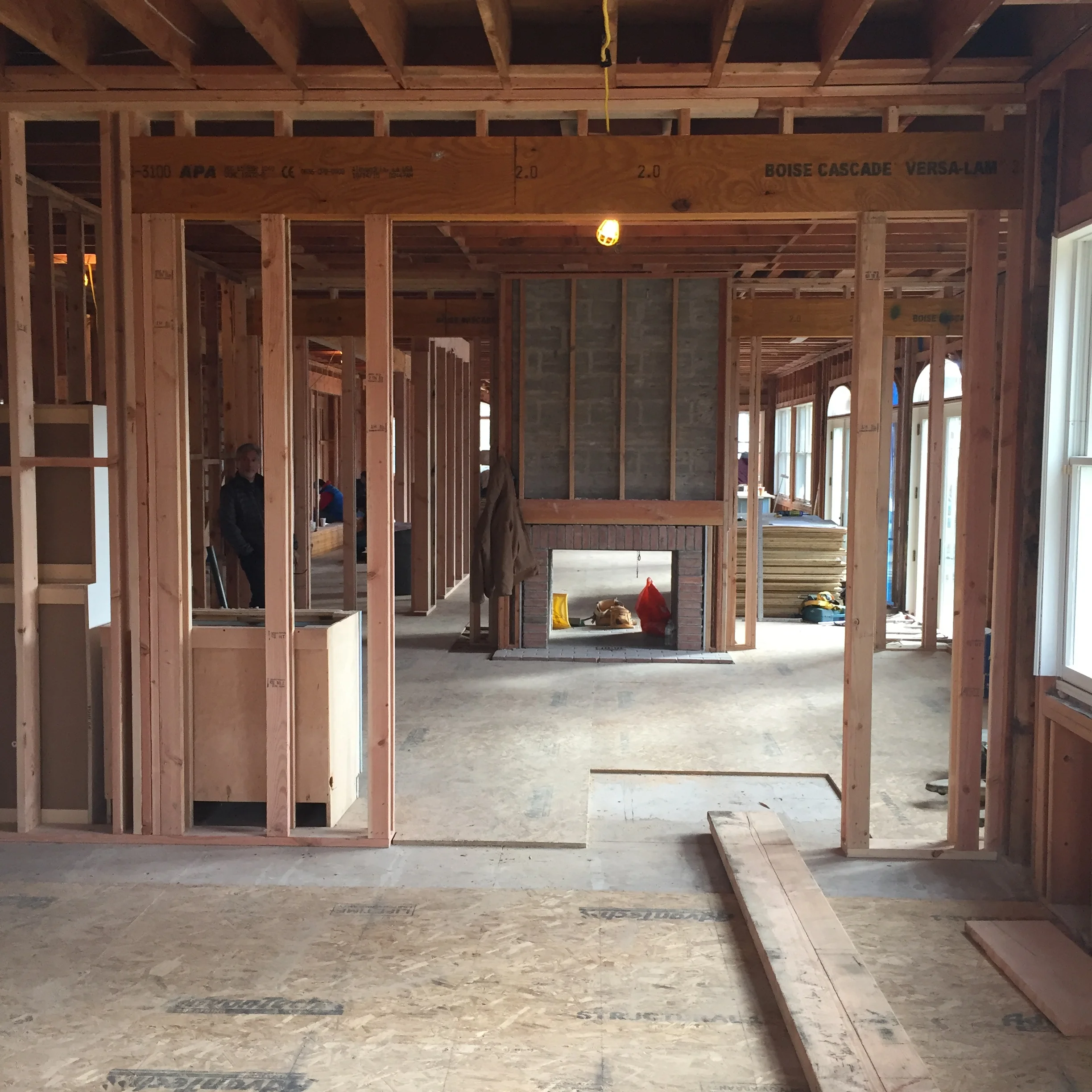 Down to the studs, this Westchester home's back-to-back fireplace is taking shape!