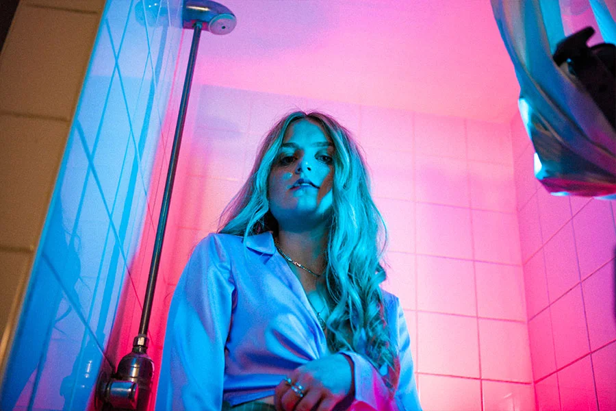 Girl-Pink-Blue-lighting-Seedy-Bathroom-Photoshoot.jpg