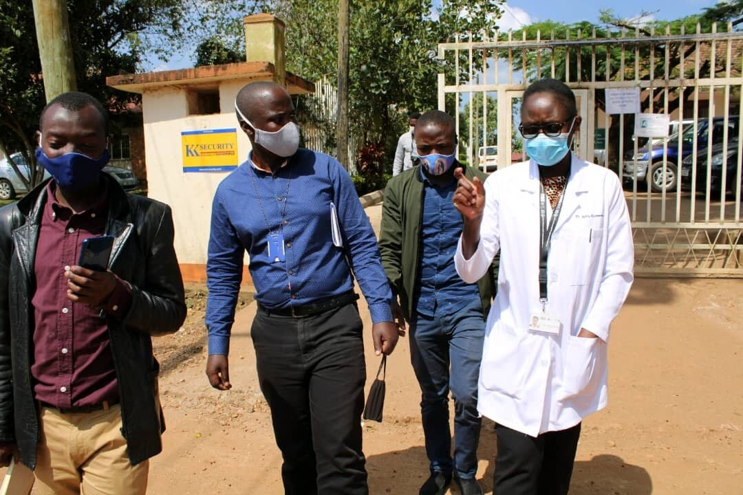 Journalists undertake a guided tour of the facilities at the Masaka field station.jpg