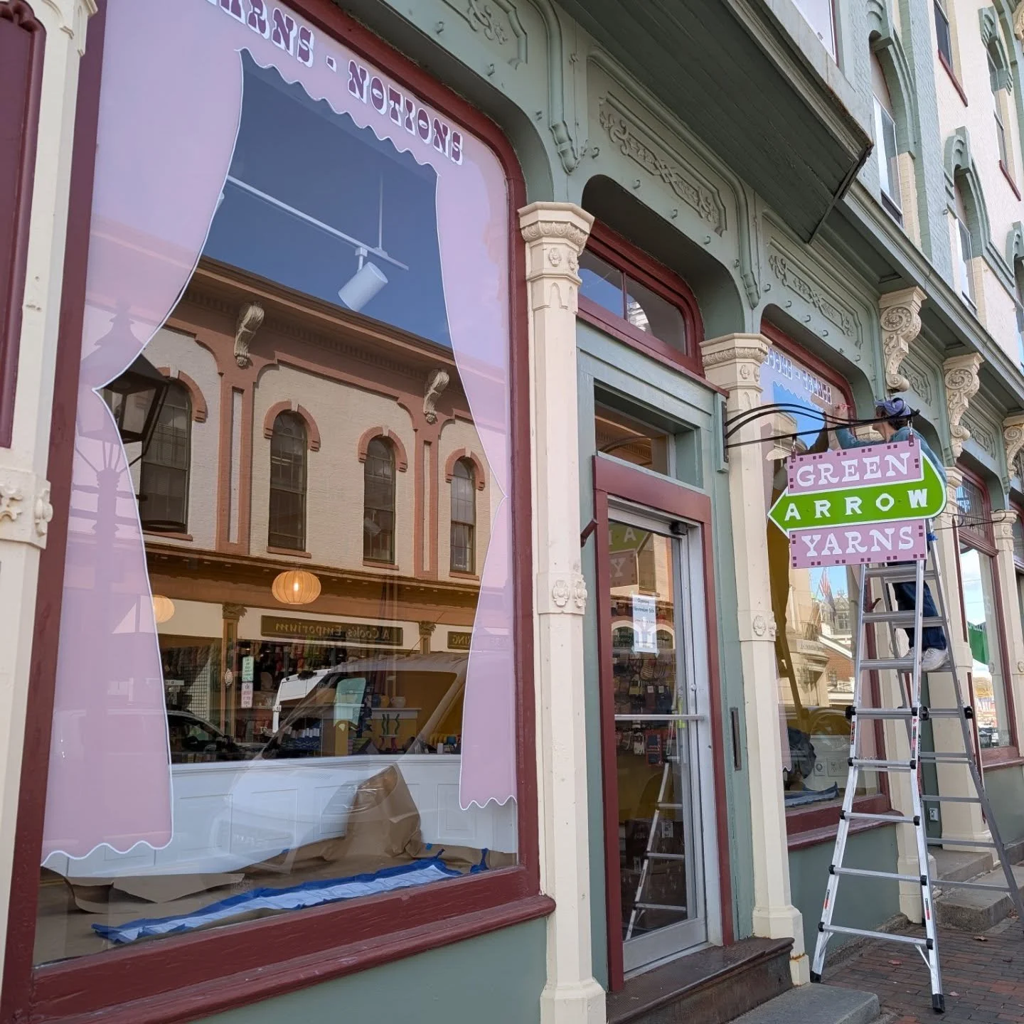 There are few things finer than picking up a soft skein of yarn, turning it over in your hands, inspecting the heft and variation of color. Our friends at @green.arrow.yarns are showcasing their wares with hand-painted storefront windows, getting rea