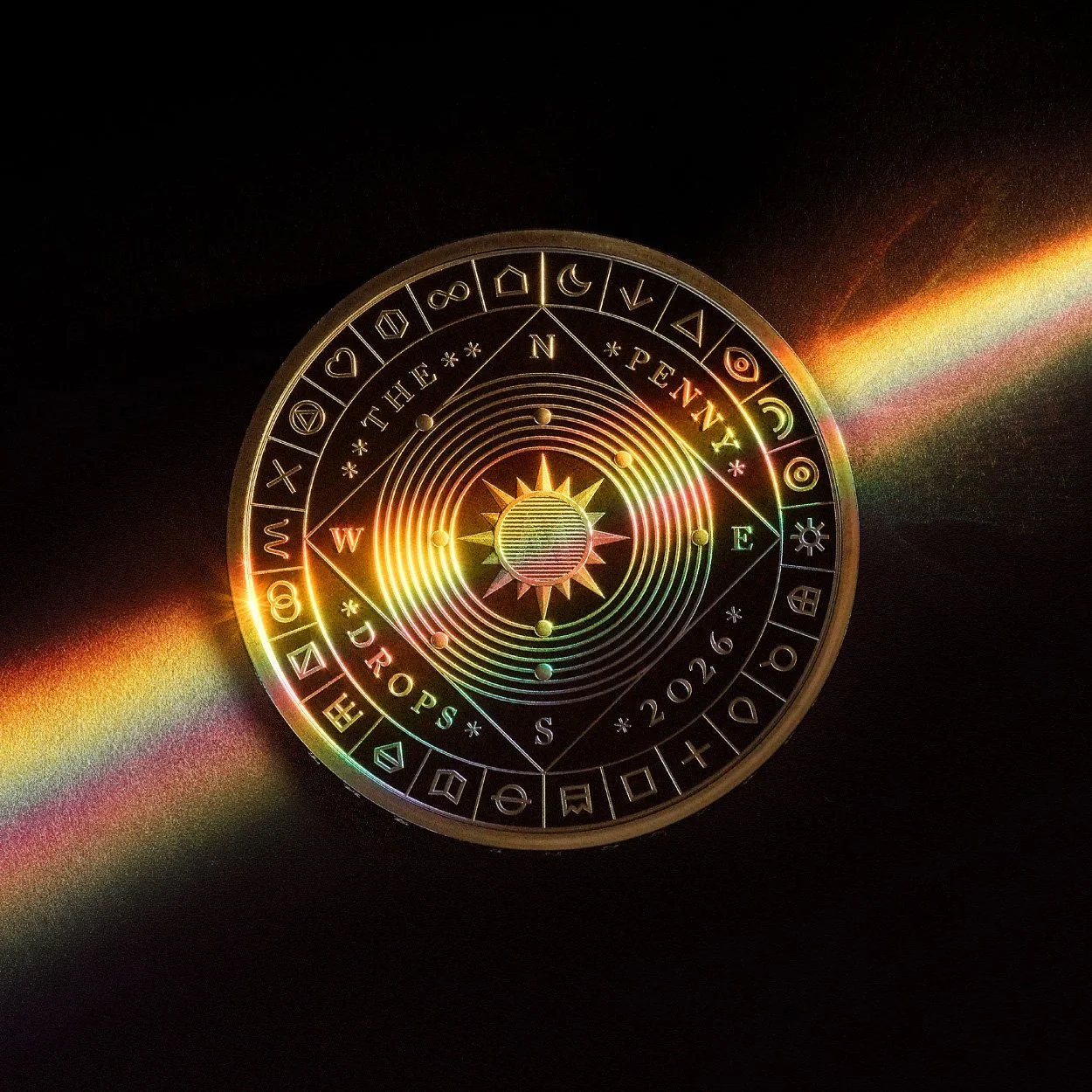 The Great British Treasure Hunt £5 coin with a band of coloured light shining across its surface