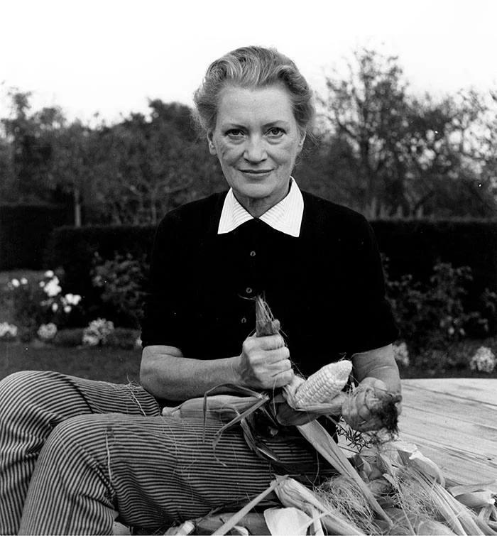 Lee Miller dehusking corn in East Sussex, England, c1960 © Roland Penrose. Lee Miller’s book on recipes “Lee Miller: A Life with Food, Friends & Recipes” by Ami Bouhasanne.