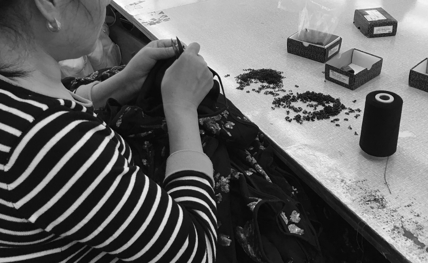 woman-sewing-sequin-blk-and-white.jpg
