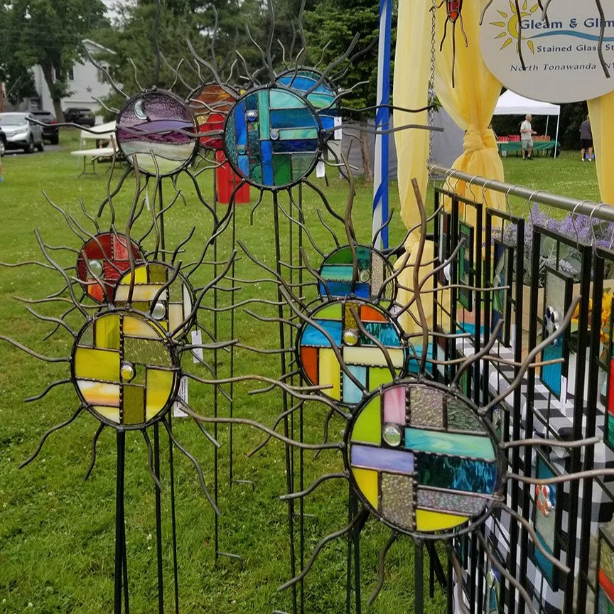 Gleam &amp; Glimmer Stained Glass Studio returns to the Garden Art Sale happening this weekend, Saturday and Sunday, June 28 &amp; 29. They will feature stained glass ground stakes, plant sticks, trellises, suncatchers and panels, and more. This year