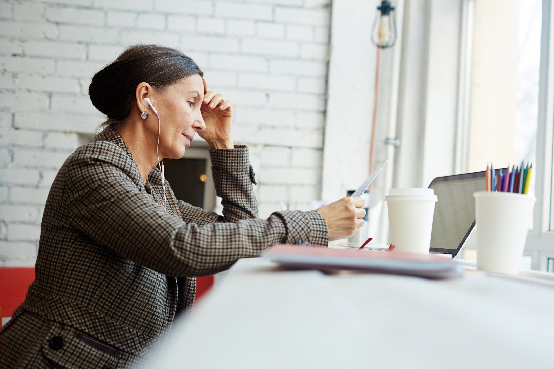 storyblocks-pensive-businesswoman-or-lawyer-reading-contract_SUggOSIDCW.jpg