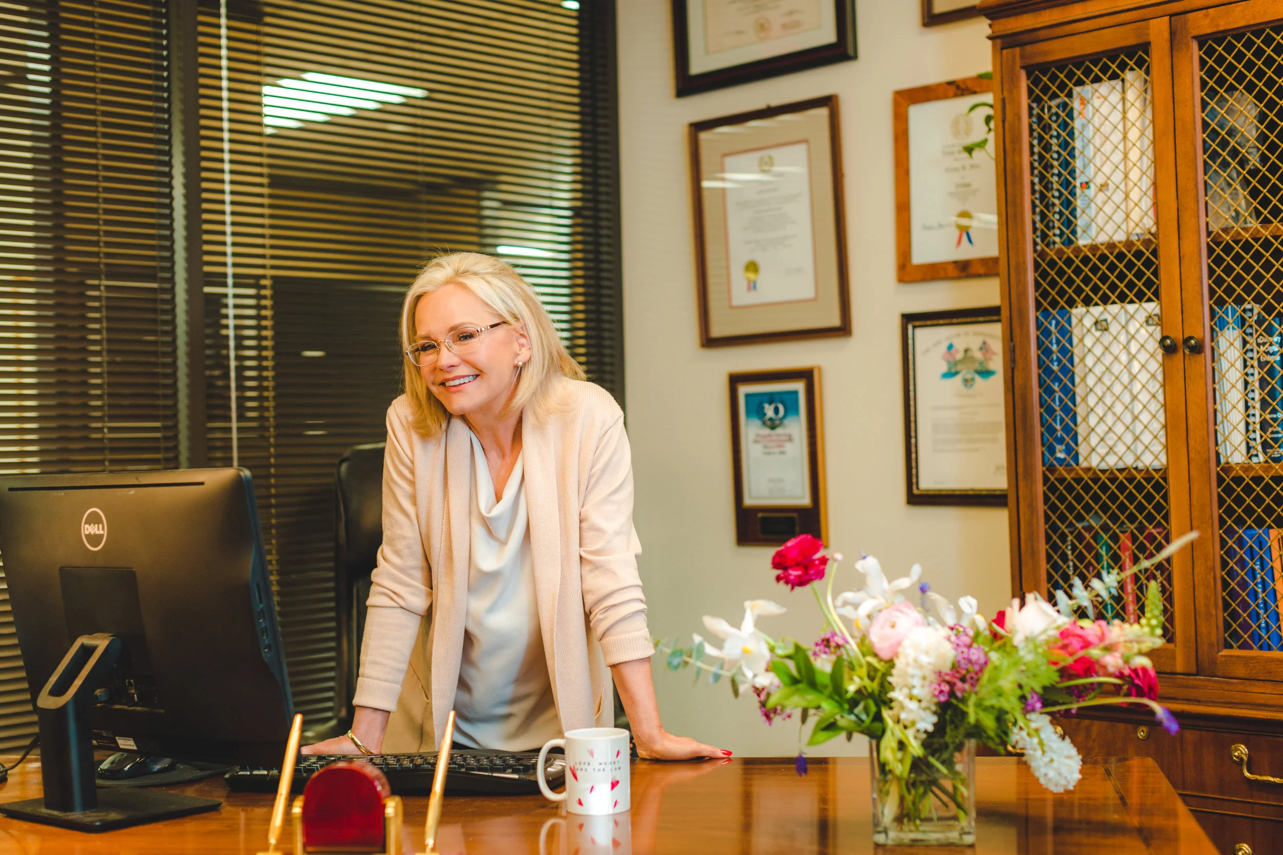 Family law attorney, and founder of Love, Money & the Law, Cindy Hide, at her desk inside her family law practice in Houston, Texas.
