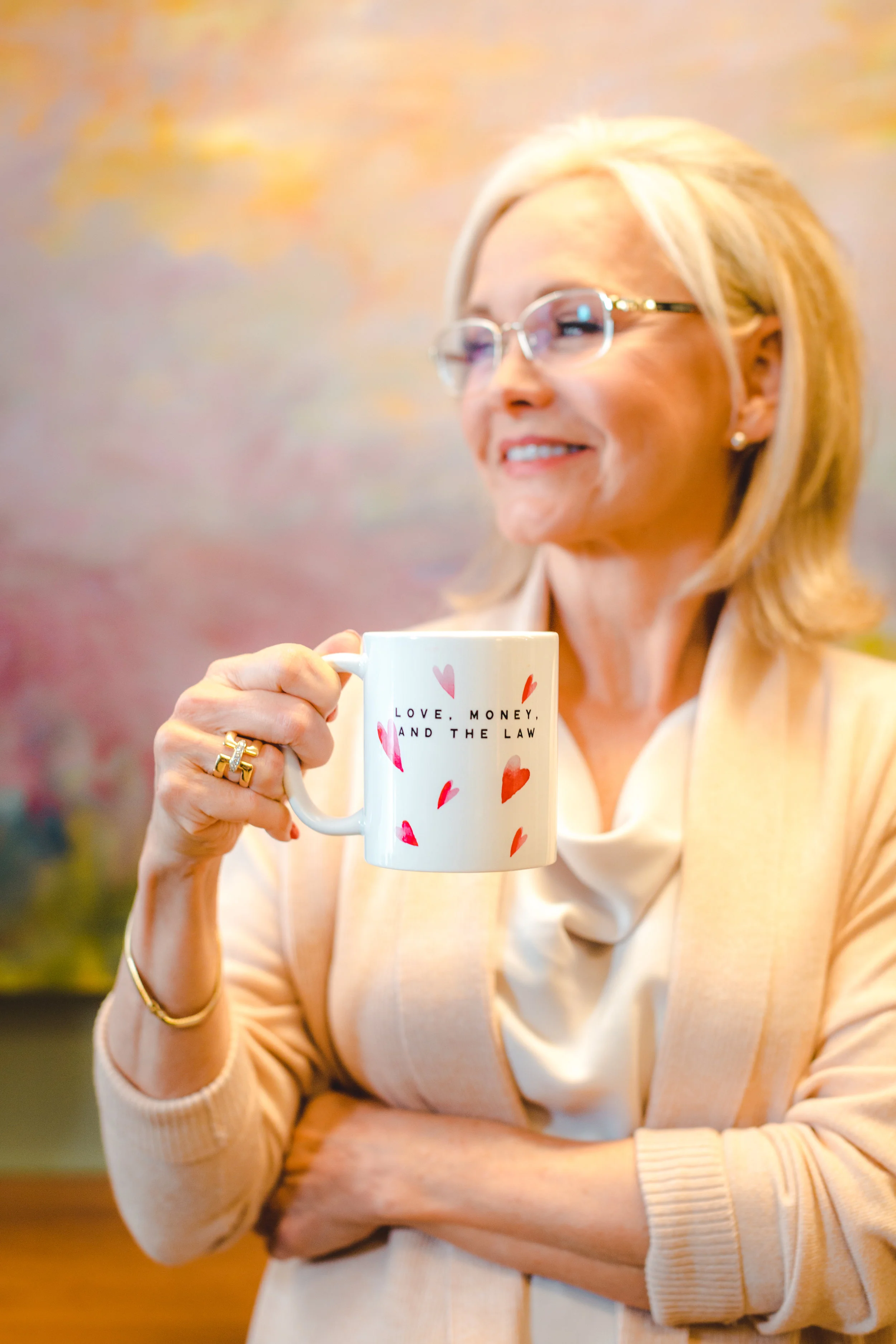 Family law attorney, and founder of Love, Money & the Law, Cindy Hide, drinking coffee inside her family law practice in Houston, Texas.