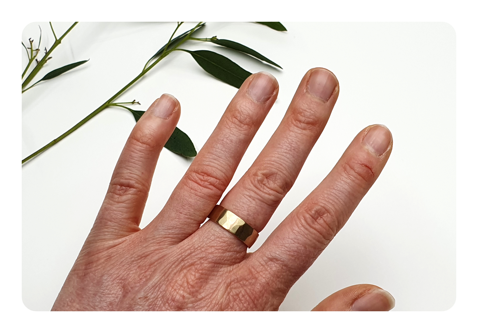 6.5mm 9ct gold flat facet on hand.png