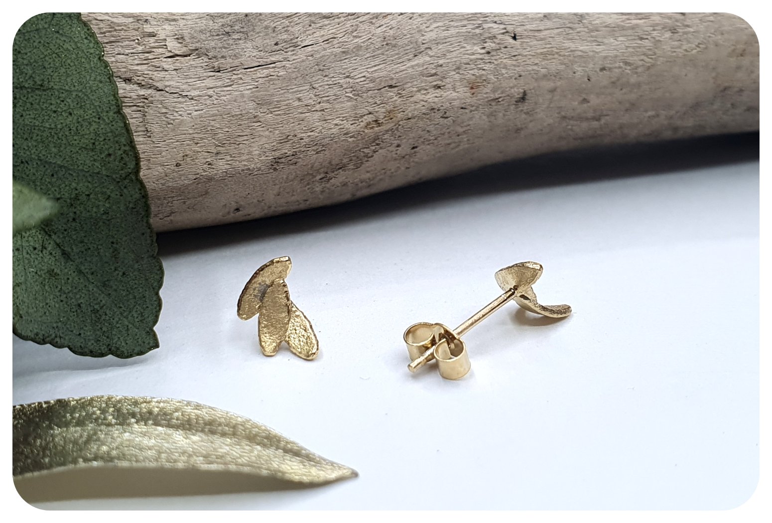 tiny gold leaves studs back 2.png