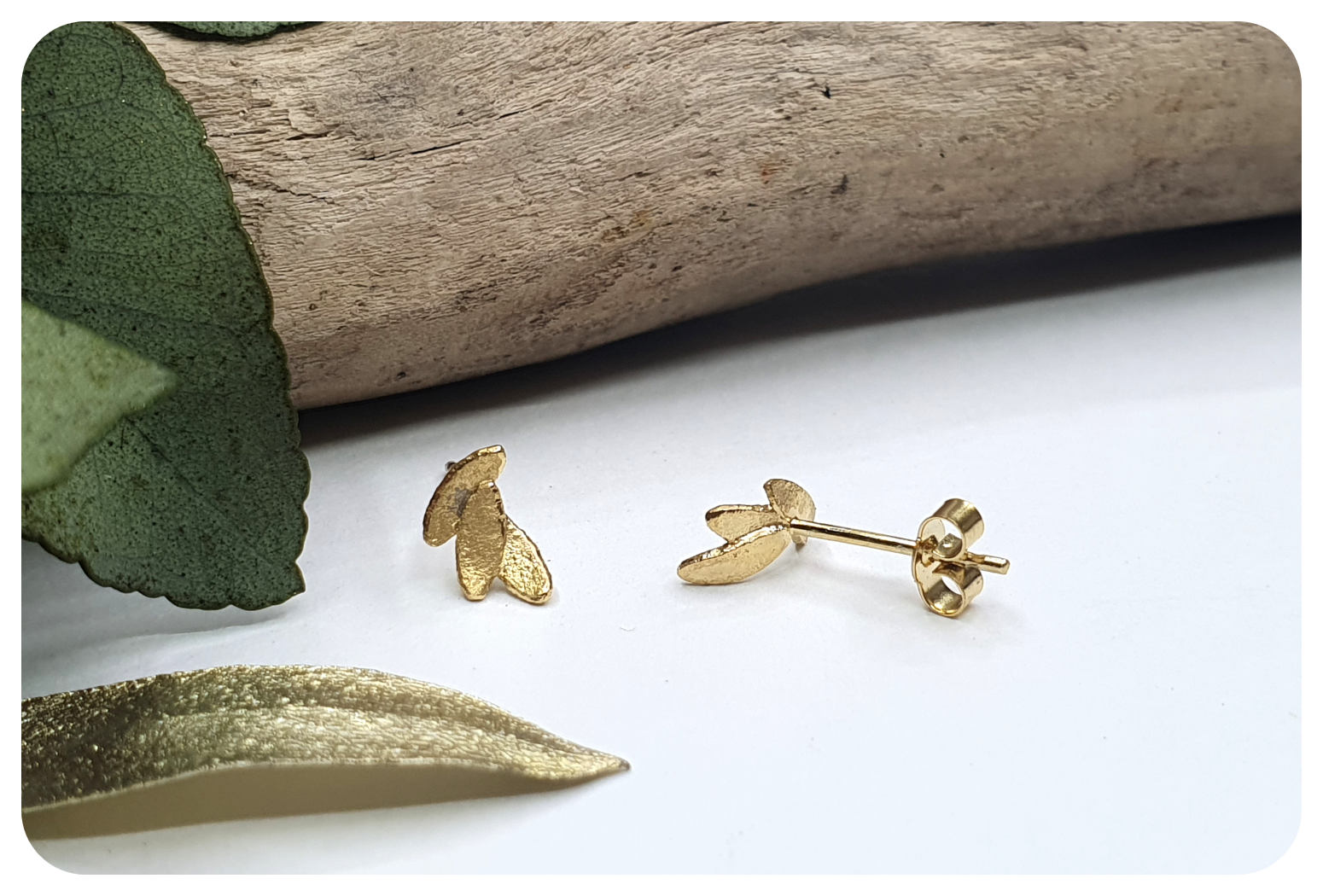 tiny gold leaves studs back.png
