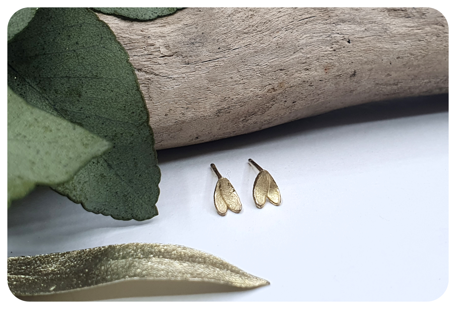 tiny gold double petal studs 2.png