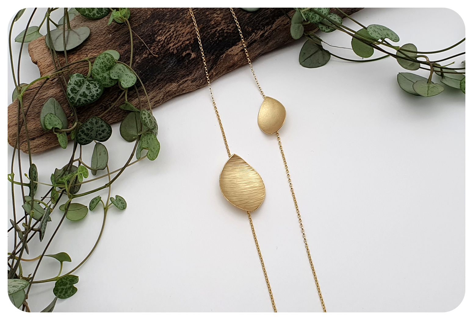 long gold leaf necklace.png