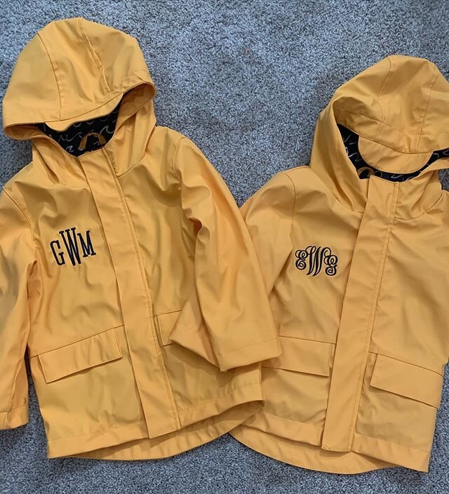 Recipe for the CUTEST rainy day: Take two raincoats, add monograms of your choice, mix in  some hugs. Voila! So sweet you&rsquo;ll swear they&rsquo;re full of sugar. (Monograms pictured are Jodie and Claire style in navy.)