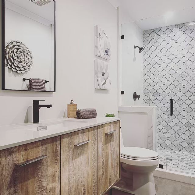 Absolutely in love with this rustic farmhouse look in this bathroom. 😻 The marble mosaic ran up the wall is a playful pop! #vittahomes  #modernfarmhouse #bathroomdesign #bathroomdecor #OCdesigners #rehabgurus #fliporflop