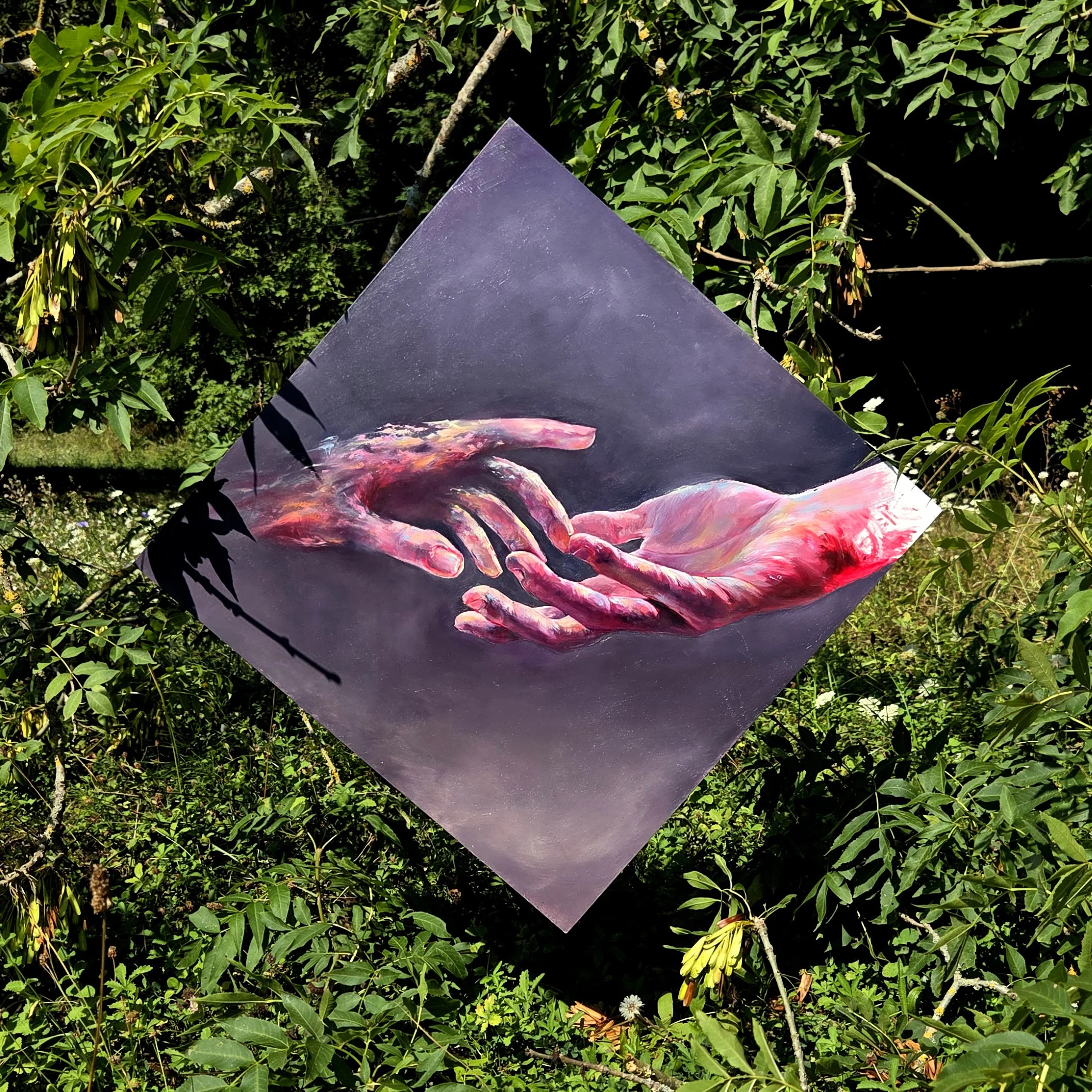 Painting of two hands almost touching on a dark background, hanging outdoors among green leafy plants.