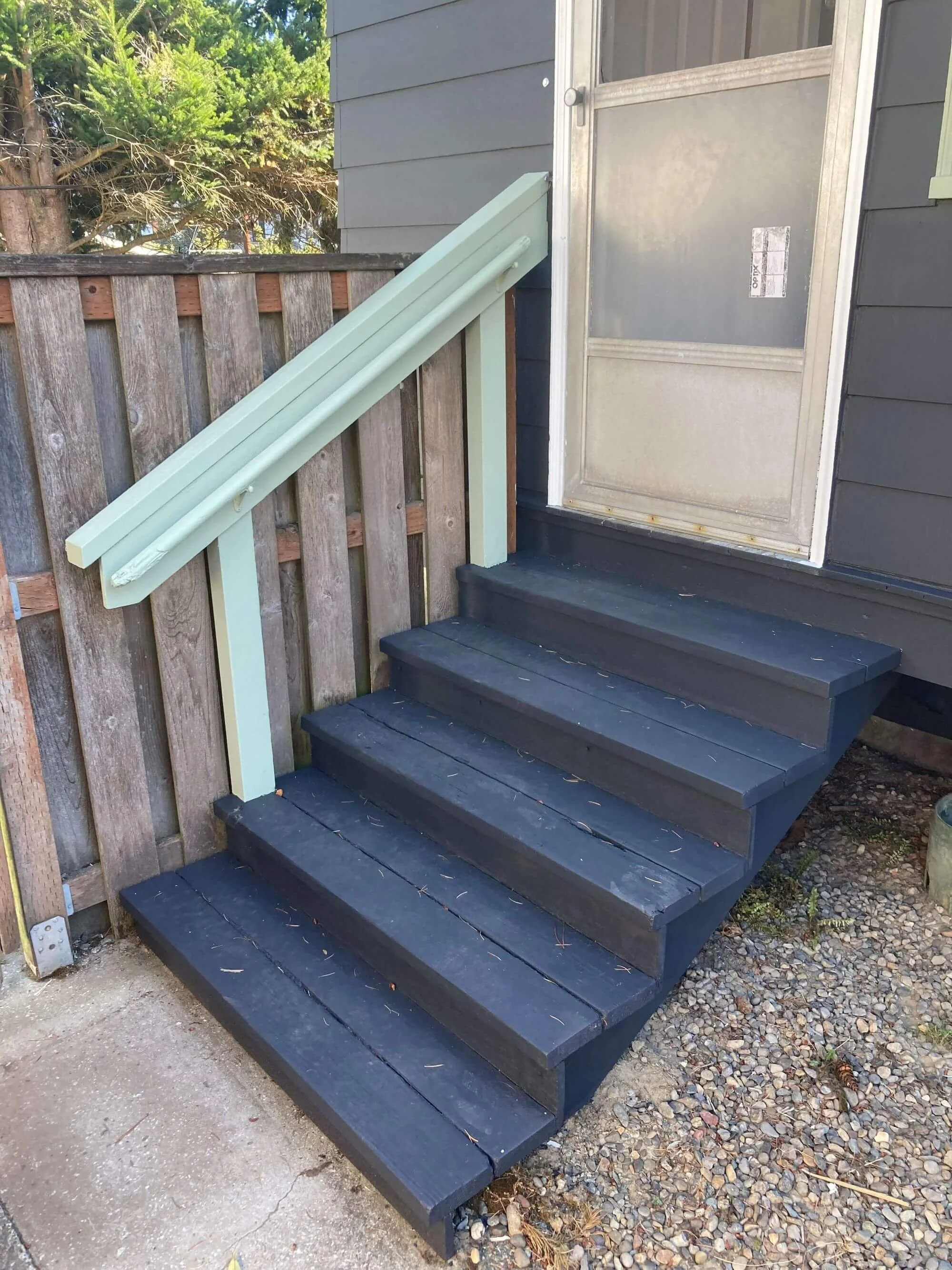 Before photo of stairs at the back door of a Seattle home, prior to new handrail installation by Gold Mountain Contracting.