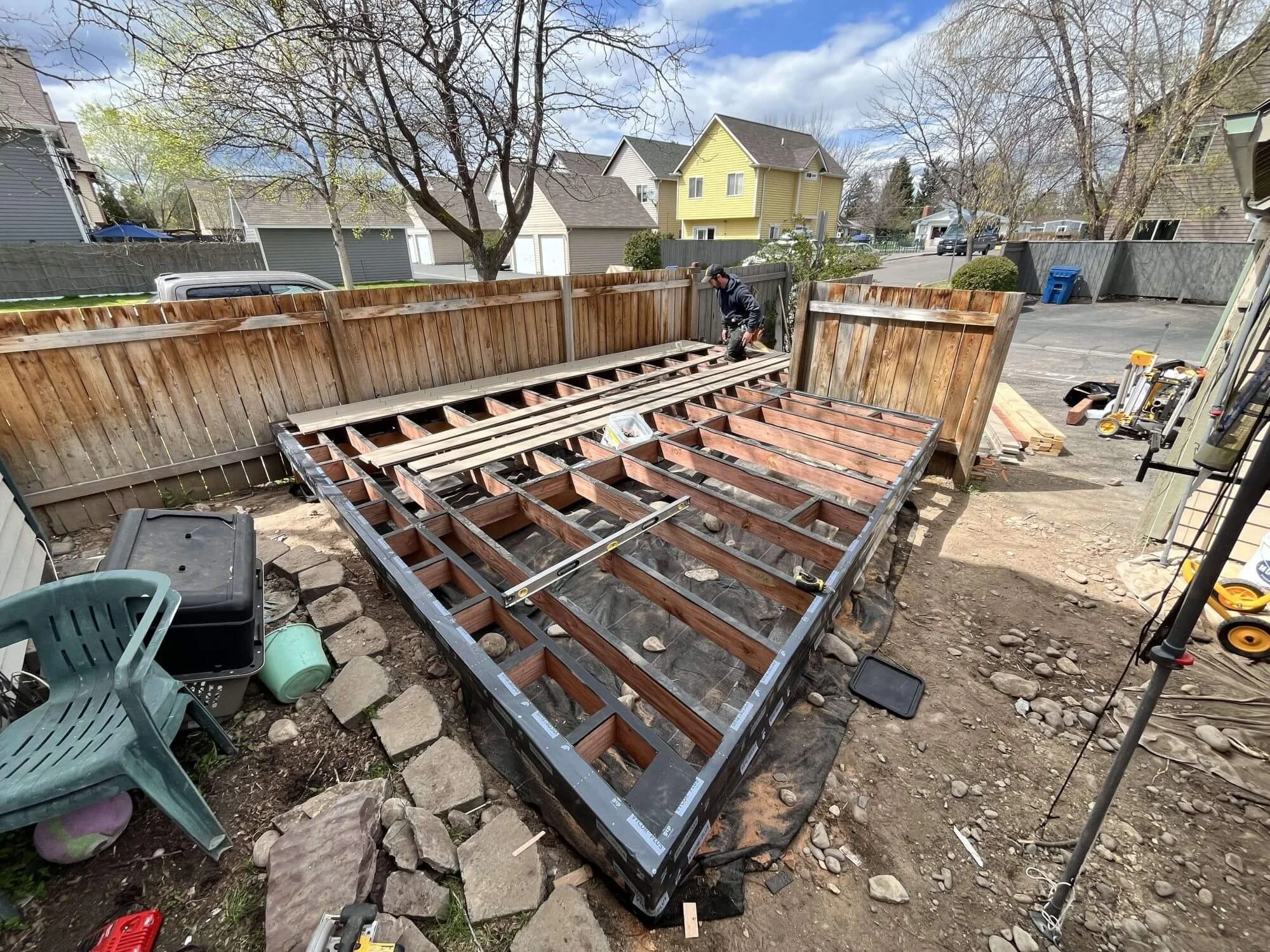 The new deck is coming together at this Seattle home. The frame is complete and now it's time to lay down the boards.