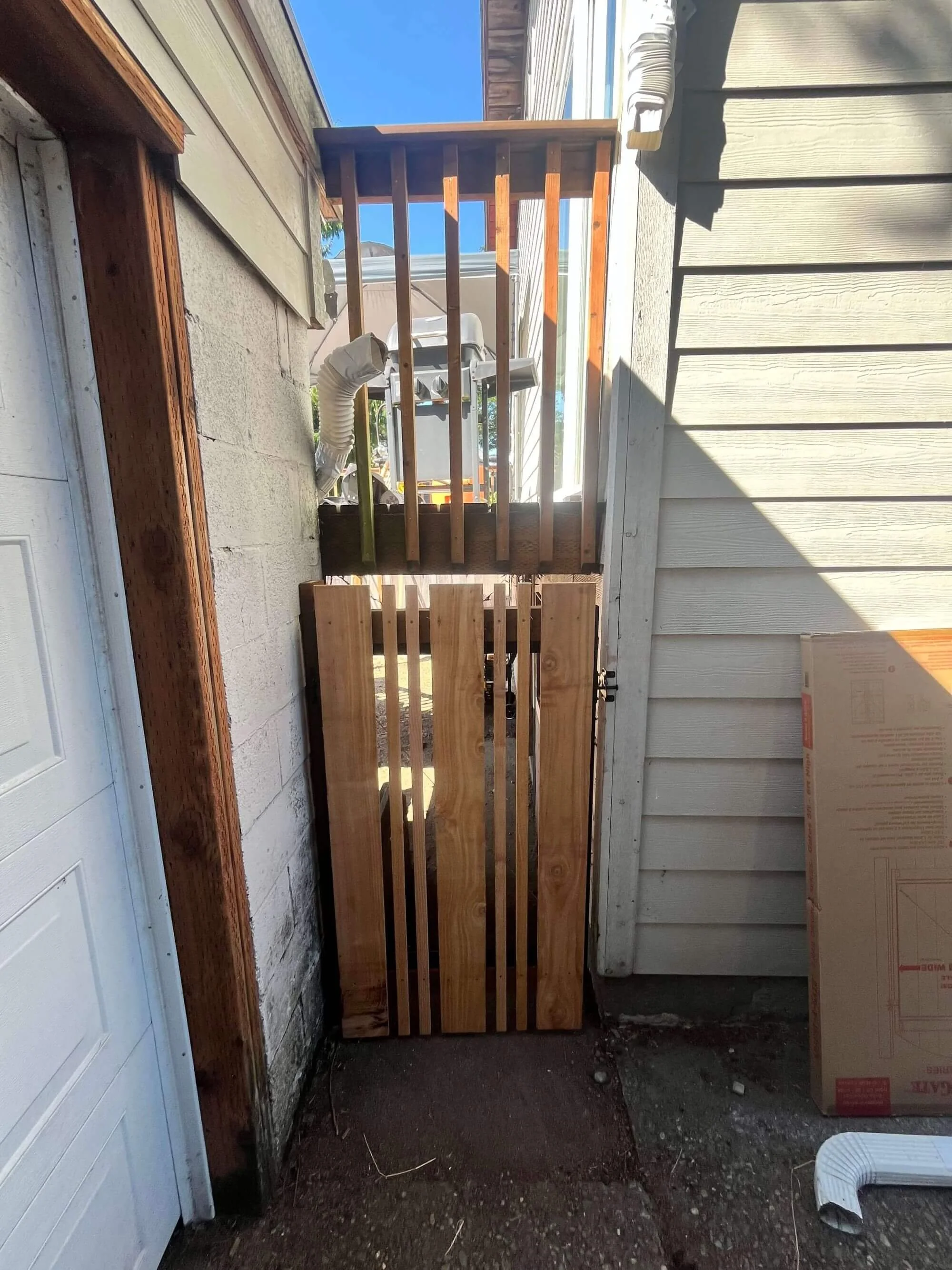 Additional custom cedar fence solution for a tight space at a Seattle area home, built by Gold Mountain Contracting.
