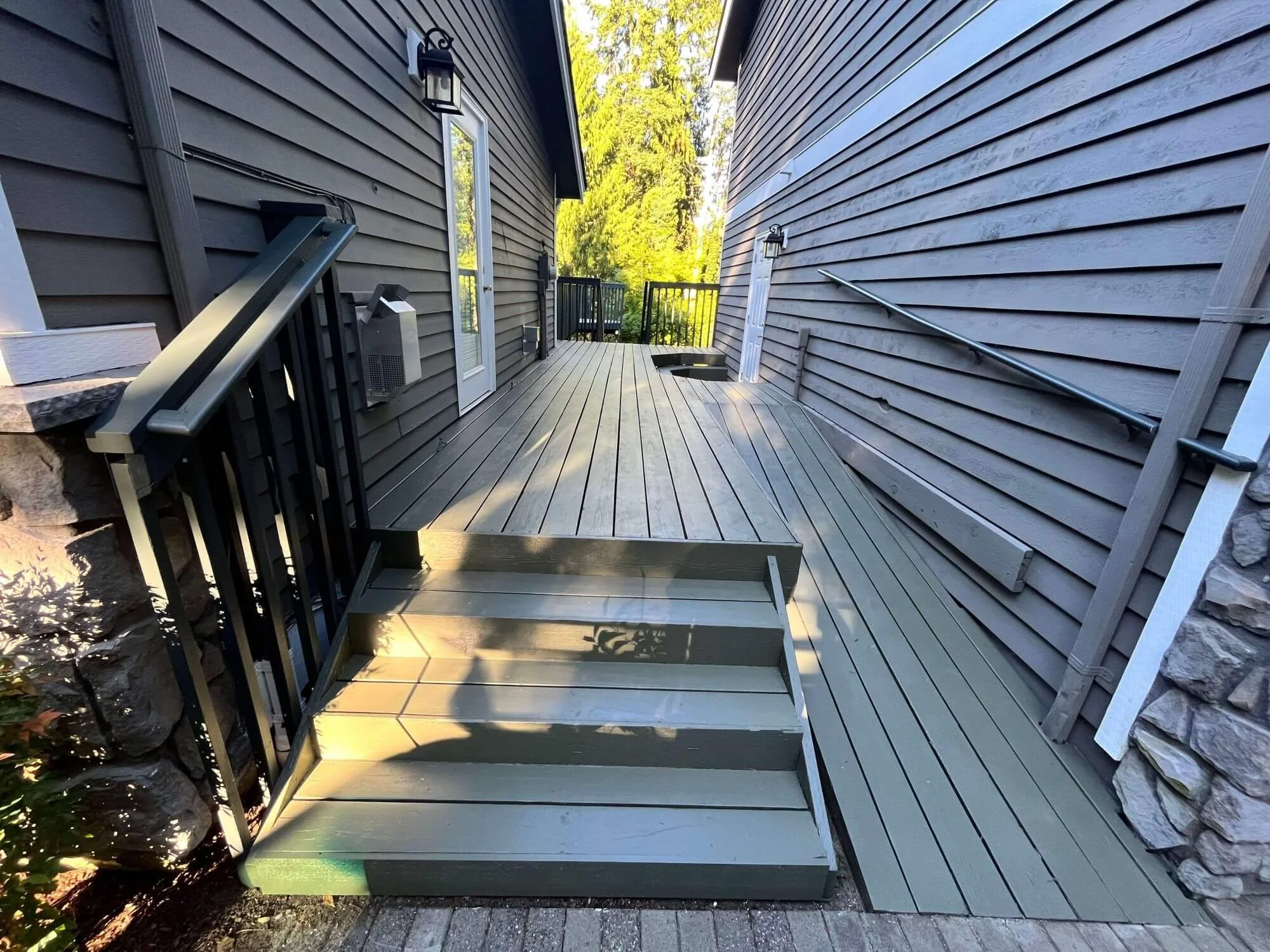 Unique staircase and ramp combo for a deck renovation project at a Renton, WA home. Designed by Gold Mountain Contracting.