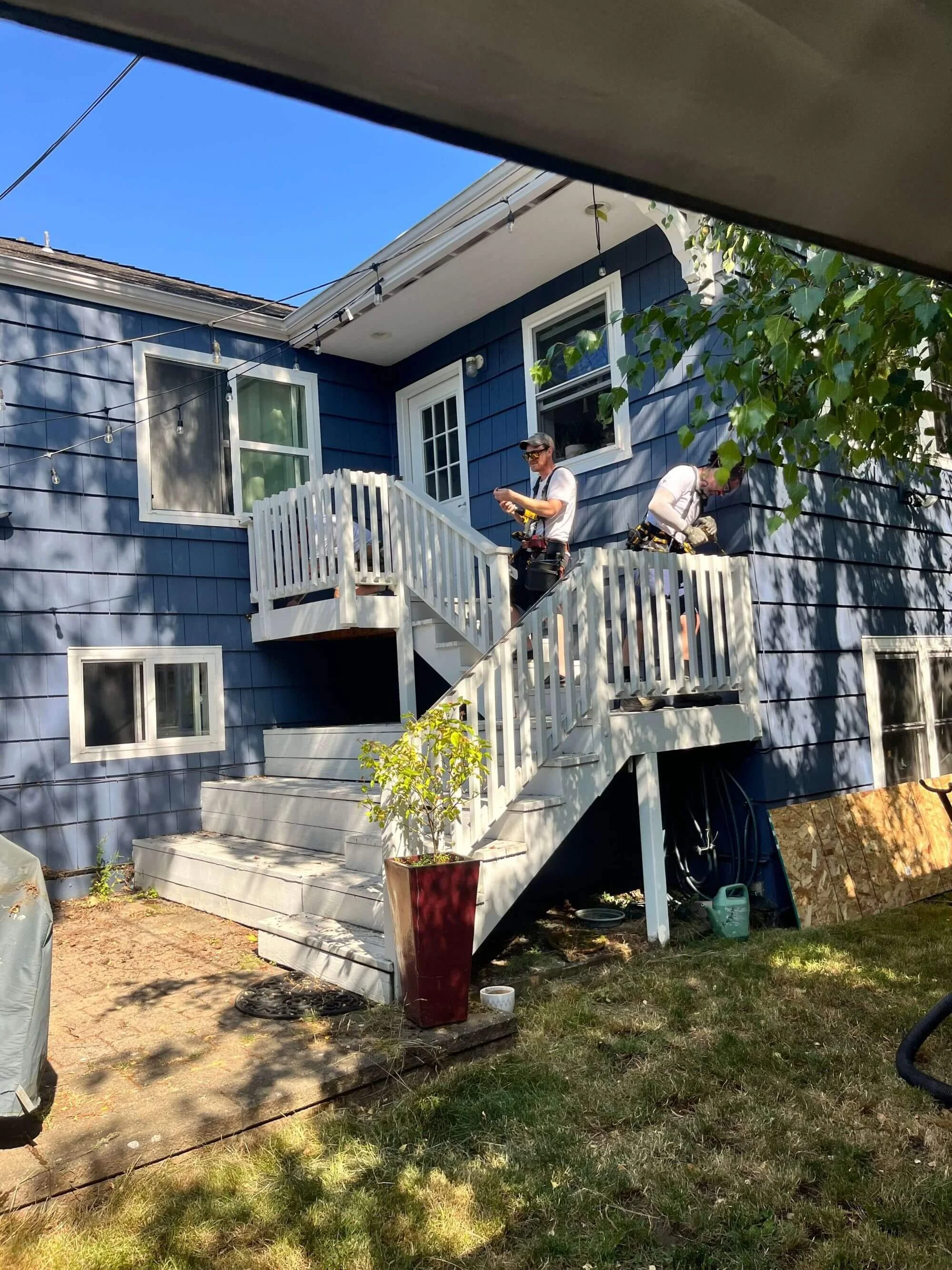 An original photo of the Seattle deck being renovated. The stairs took up most of the space, leaving little room.