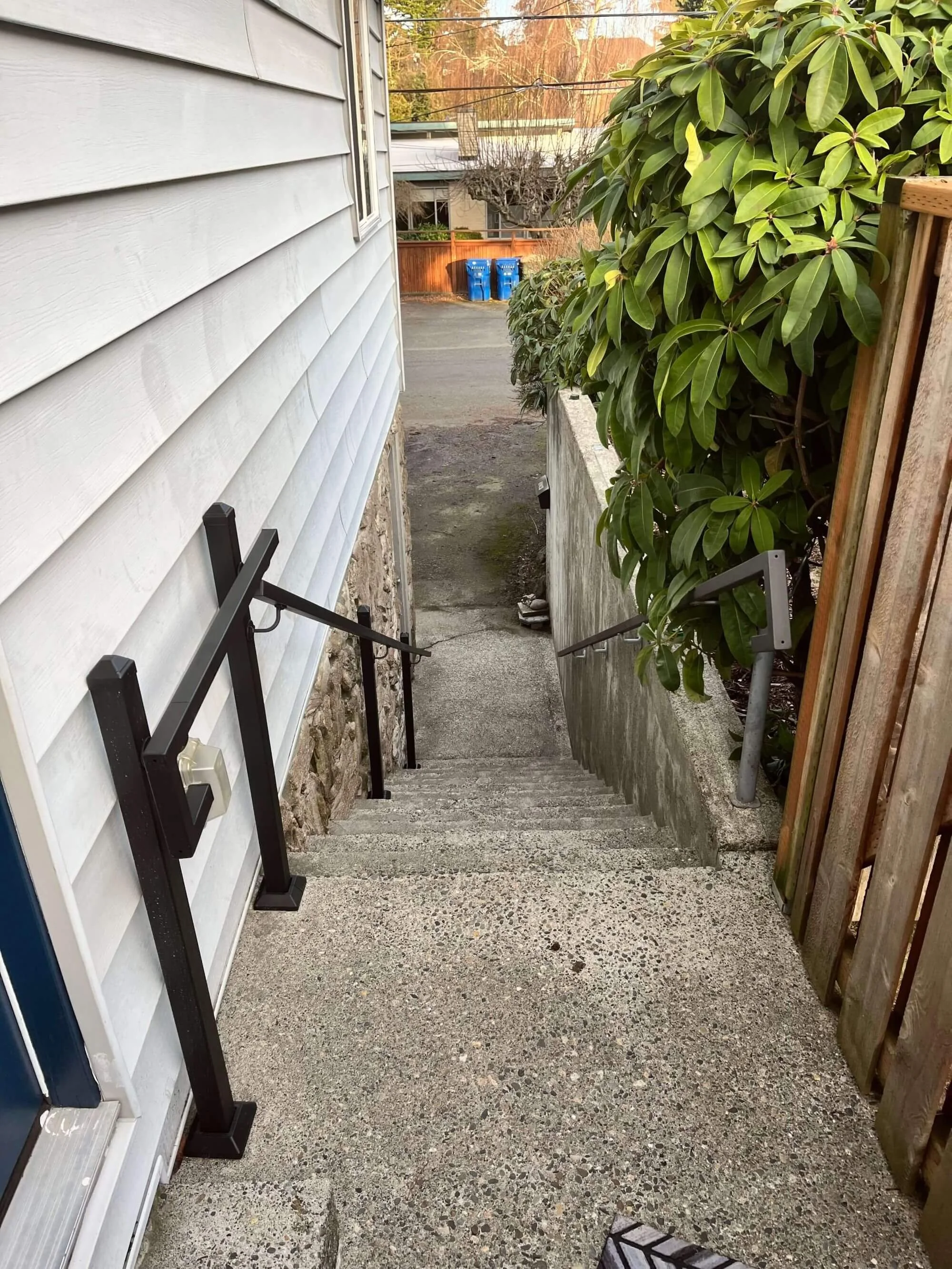 Metal handrails offer increased safety and help landlords comply with Seattle rental home regulations.