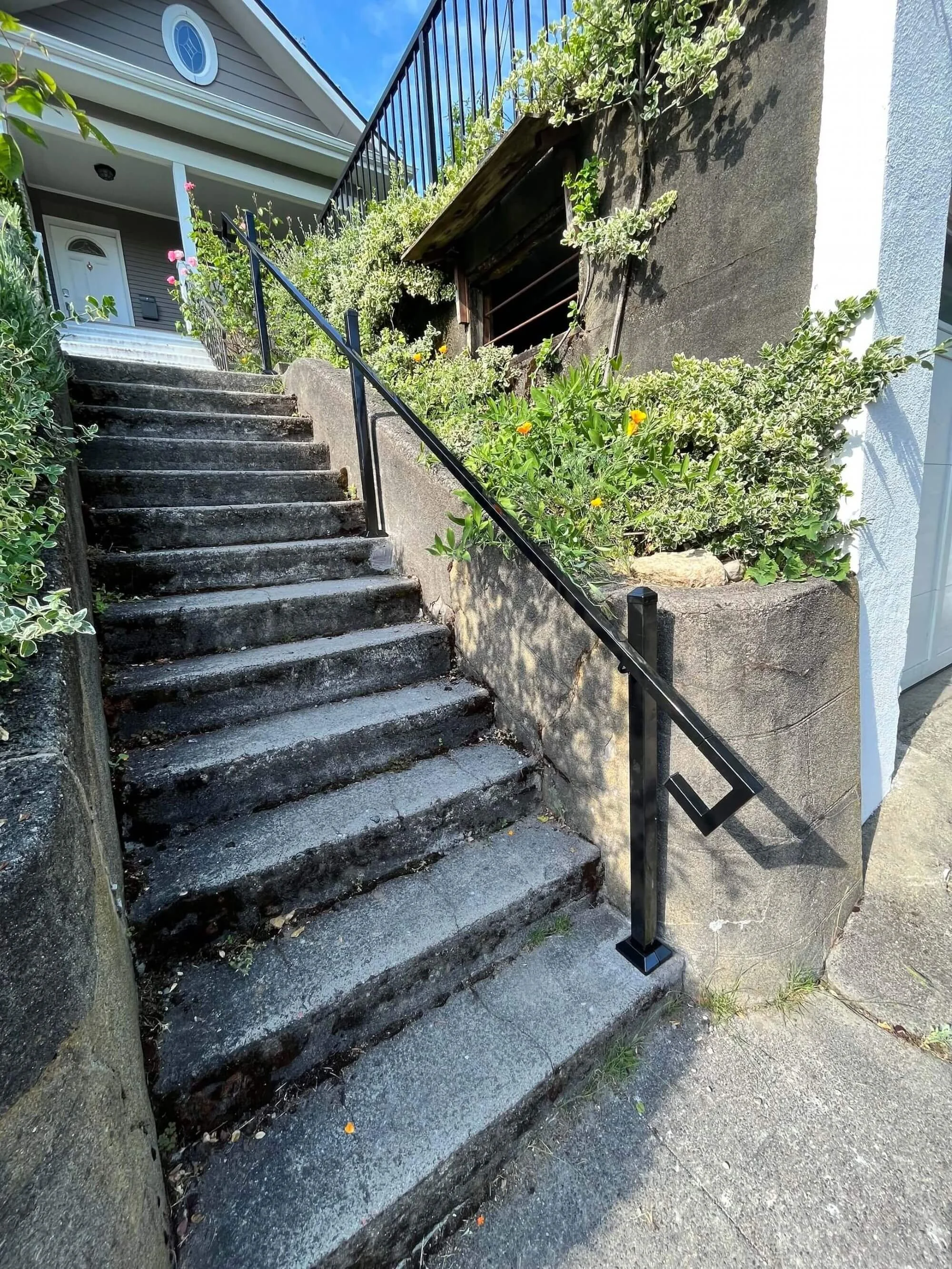 A new handrail installation for a home in Cherry Hill to comply with Seattle landlord regulations for tenant safety.