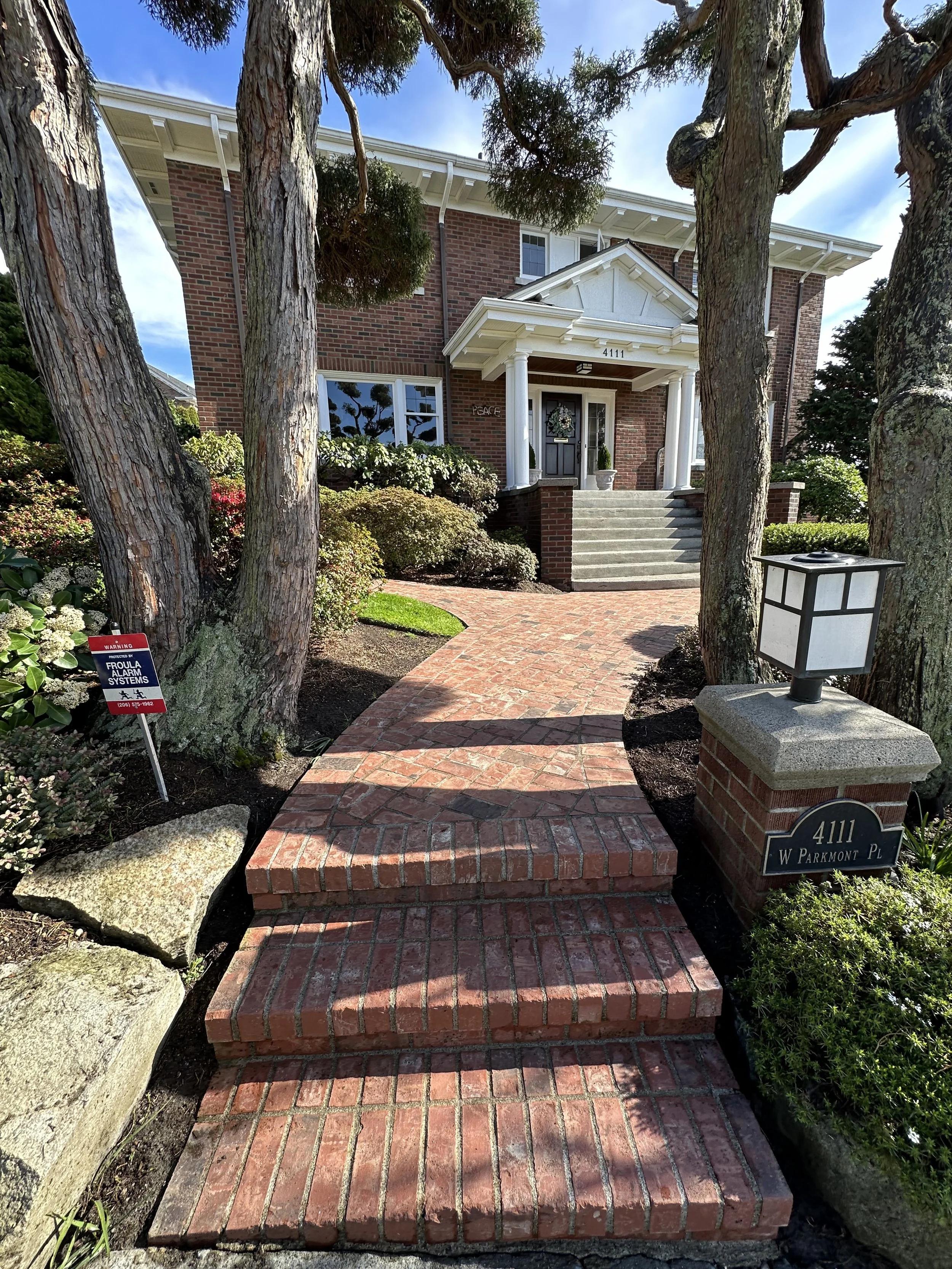A brick walkway at a home in Seattle, gleaming after Gold Mountain Contracting pressure washed it.