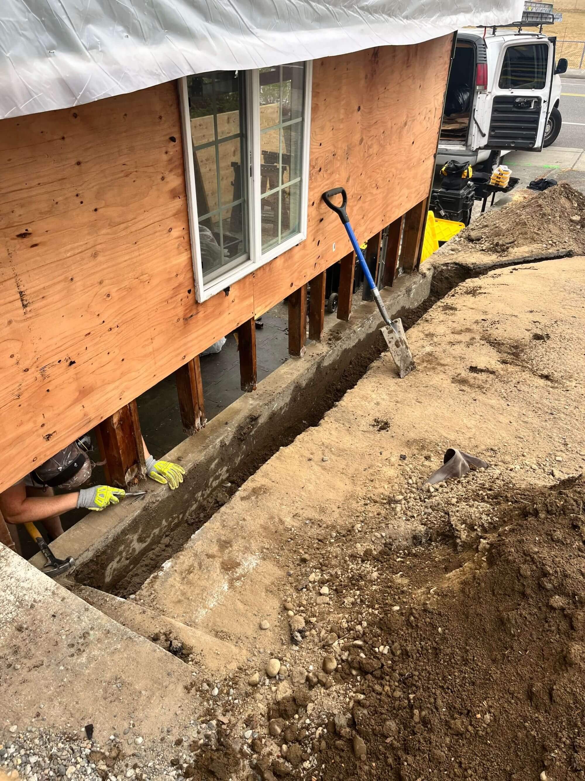 Replacing damaged wood and siding prior to finishing the new drainage ditch at a Seattle area home.