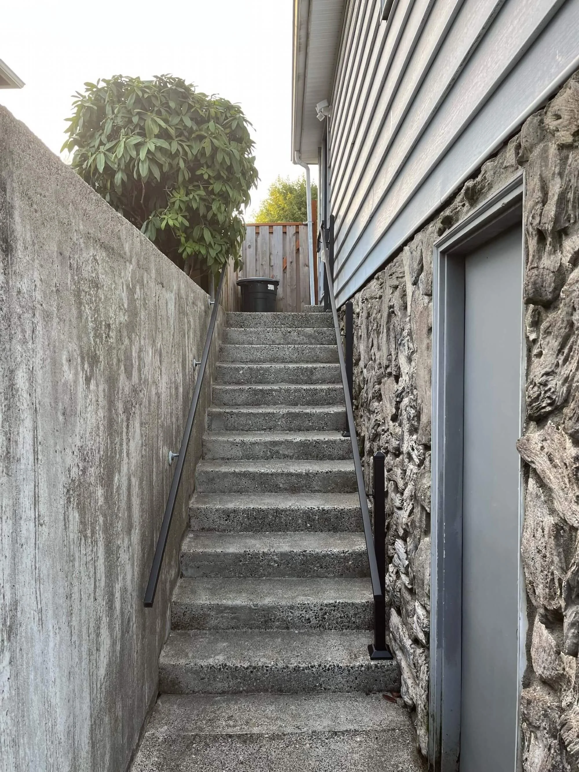 Additional exterior stair set with new metal handrails, courtesy of Gold Mountain Contracting in Seattle.